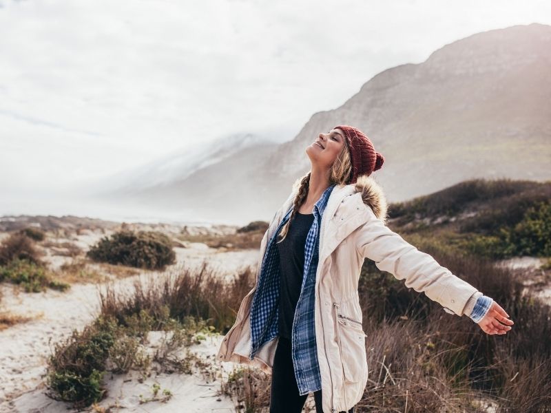 hipster woman breathing mountain