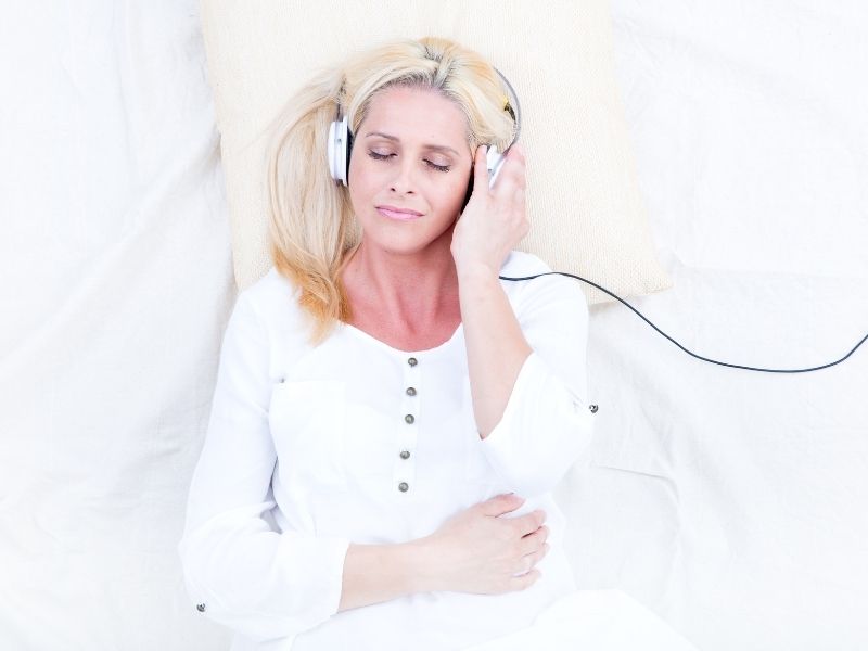 woman relaxing headphone on hypnosis