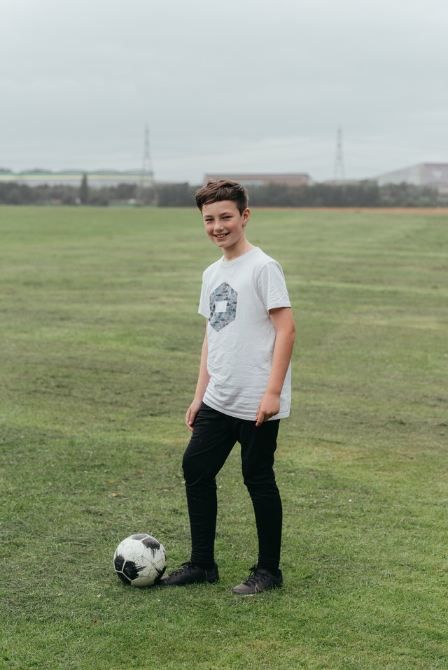 A child playing soccer.
