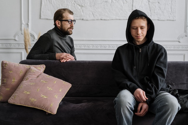 A photo of a father and his son.