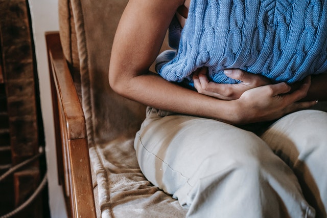 Woman having abdominal pain.